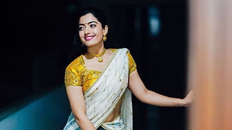 HD-wallpaper-beautiful-rashmika-mandanna-is-wearing-yellow-white-half-saree-and-golden-jewels-girls-thumbnail