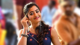 HD-wallpaper-rashmika-mandanna-is-standing-in-blur-people-background-wearing-blue-dress-girls-thumbnail