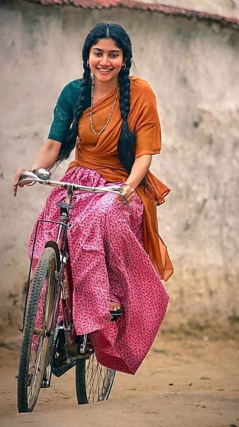 HD-wallpaper-sai-pallavi-cycling-village-girl-thumbnail