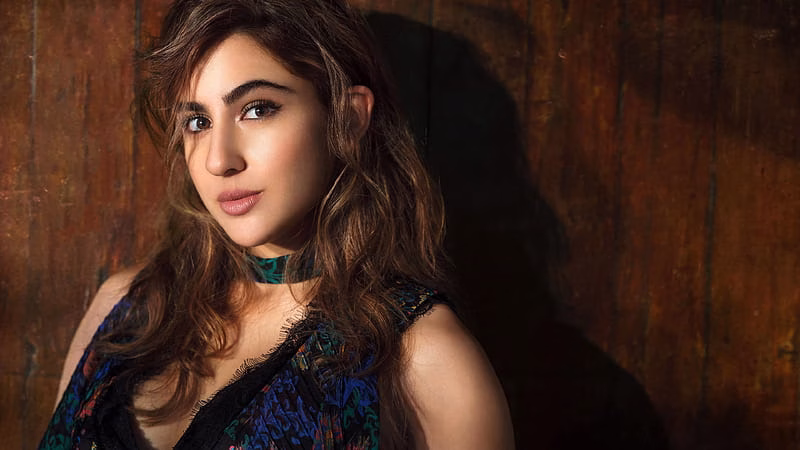 HD-wallpaper-sara-ali-khan-is-wearing-blue-dress-in-wooden-door-background-girls