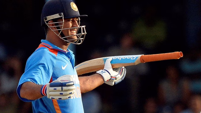 HD-wallpaper-smiley-ms-dhoni-with-bat-is-wearing-blue-sports-dress-and-helmet-dhoni