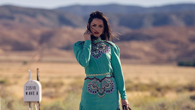 HD-wallpaper-ana-de-armas-is-standing-in-a-greenfield-with-a-background-of-blur-mountain-wearing-turquoise-color-dress-celebrities