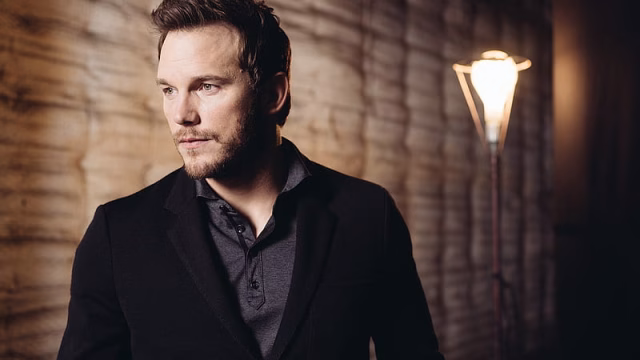 HD-wallpaper-chris-pratt-is-wearing-black-overcoat-standing-in-wall-background-with-light-boys