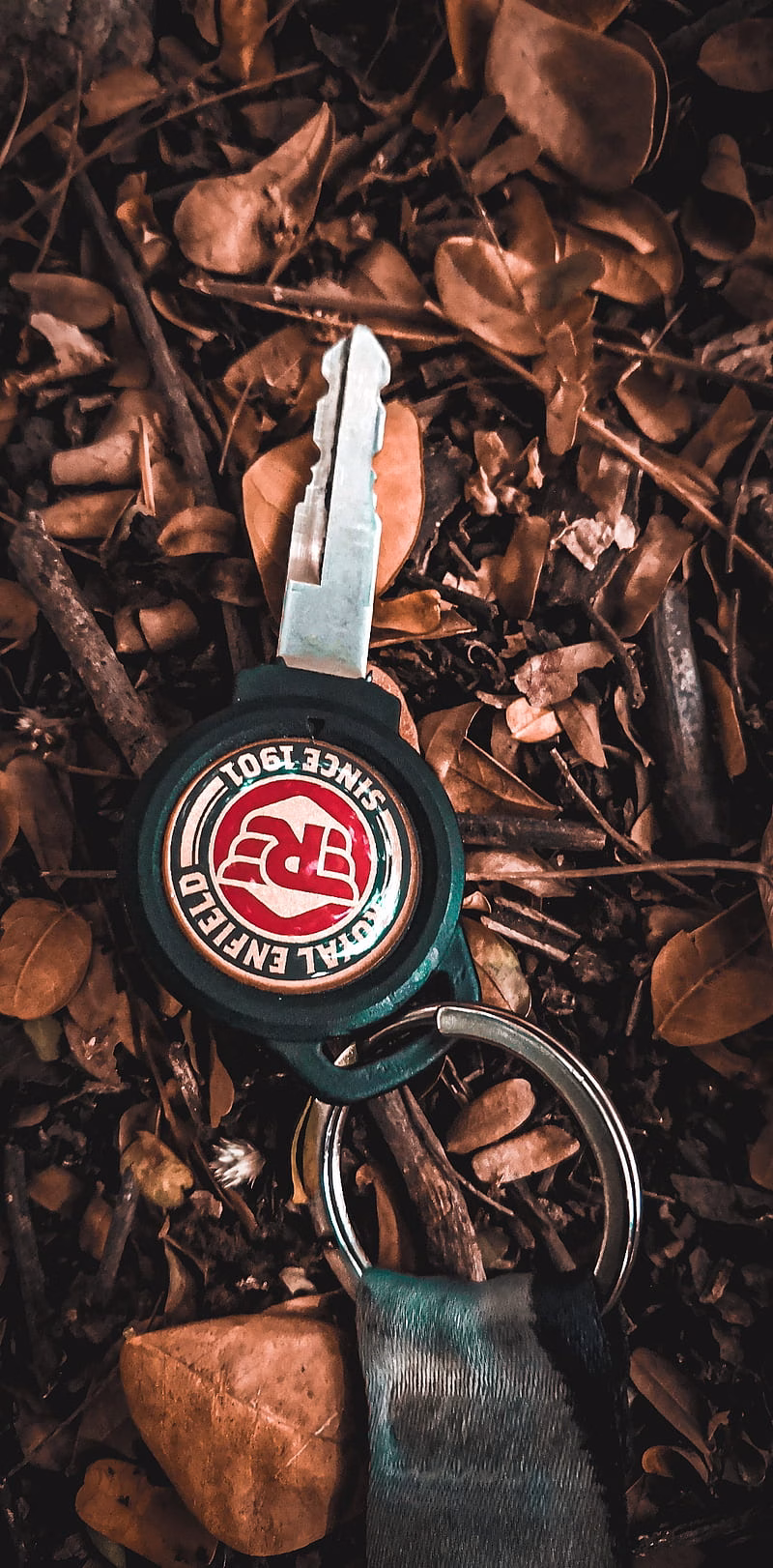 HD-wallpaper-royal-enfield-key-himalayan-iron-logo-premier-royal-enfield-shield-success